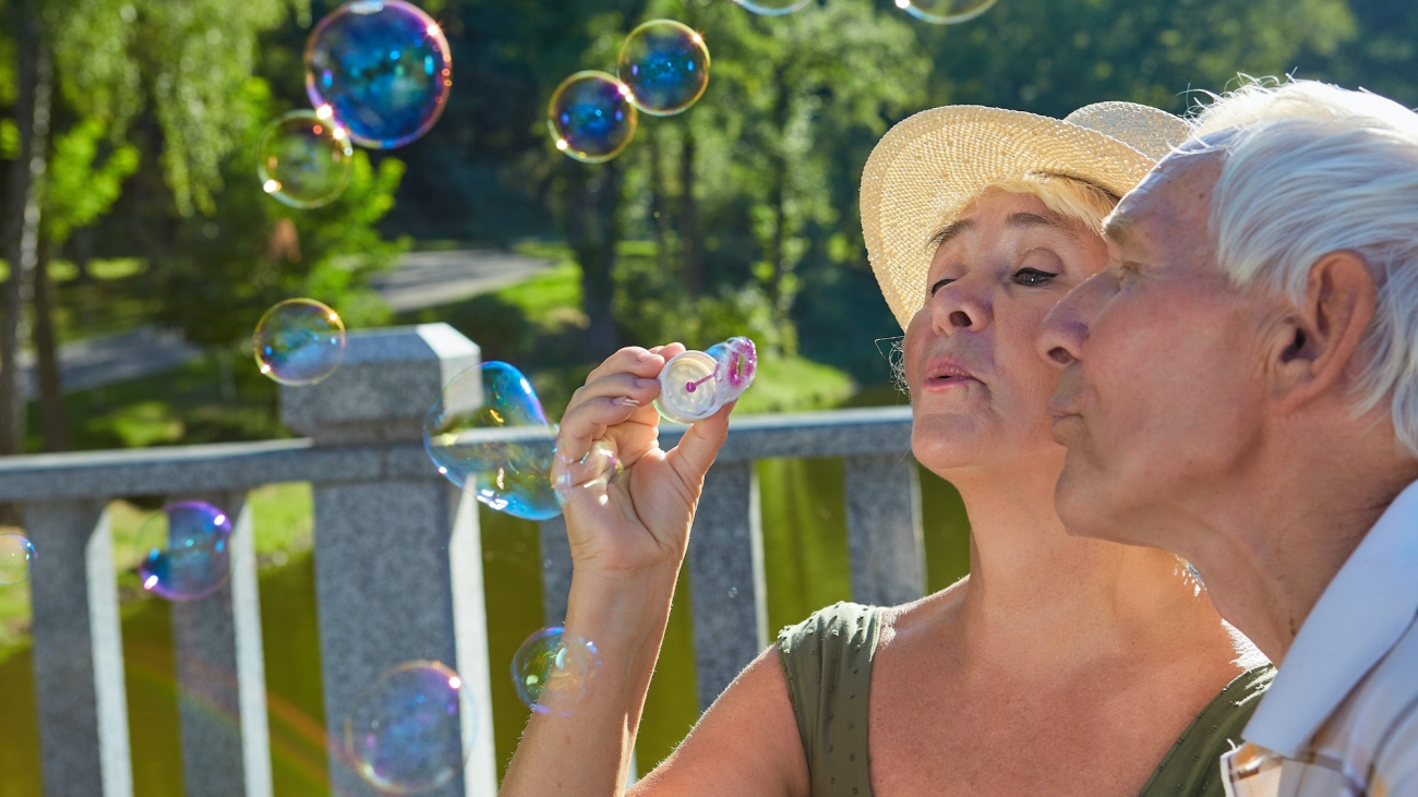 Old people with bubble blower